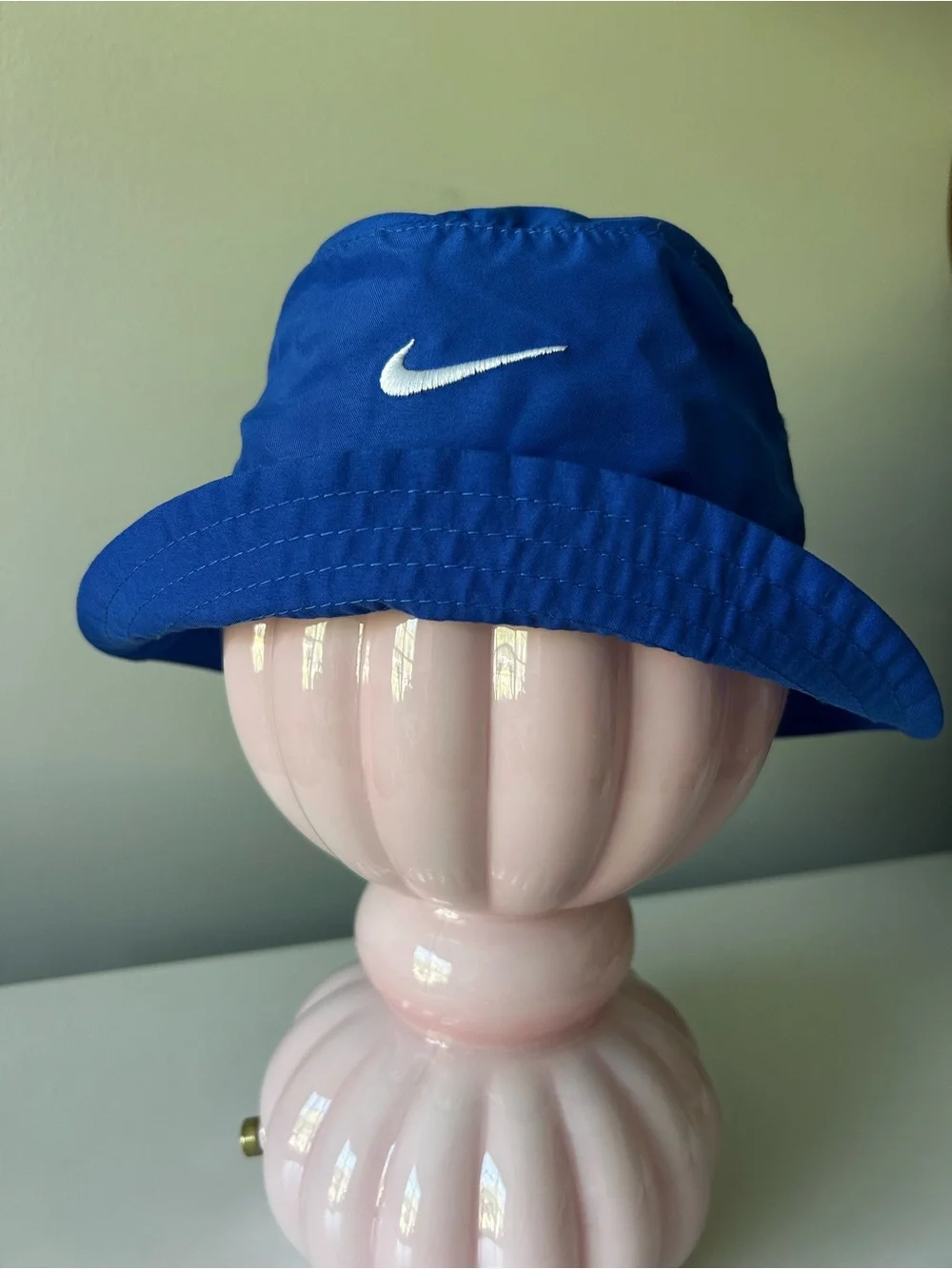 Infant blue Nike bucket hat with Velcro neck strap UPF 40+